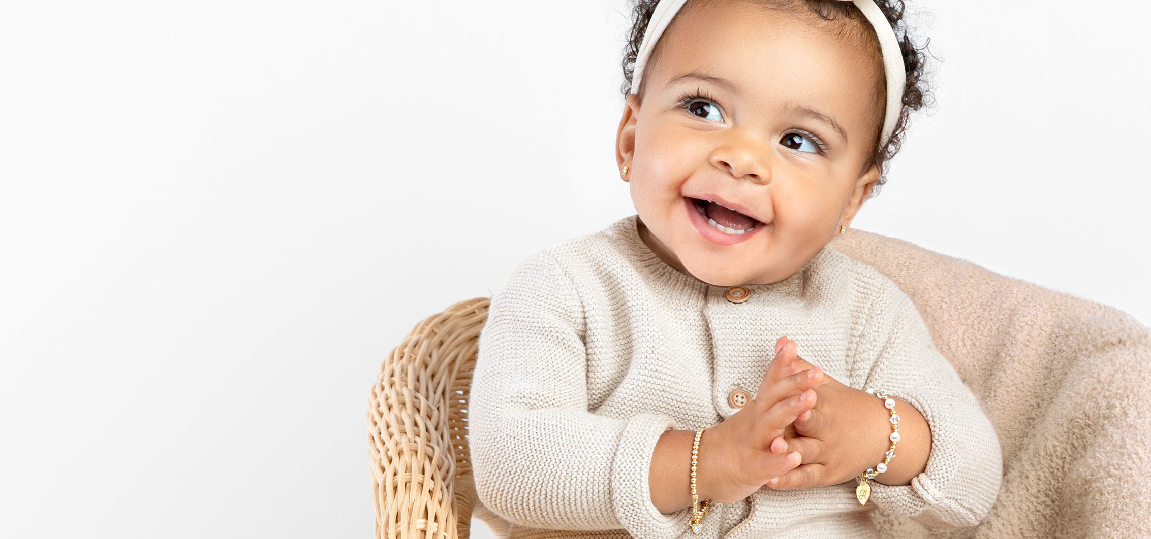 Child wearing 14k gold jewelry