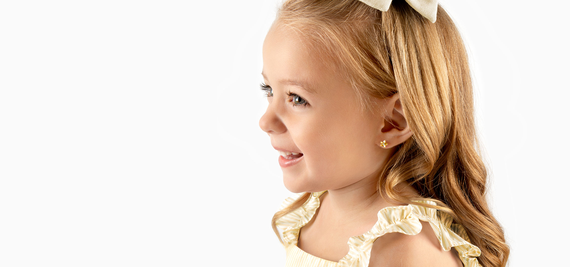 Smiling Child With Earrings